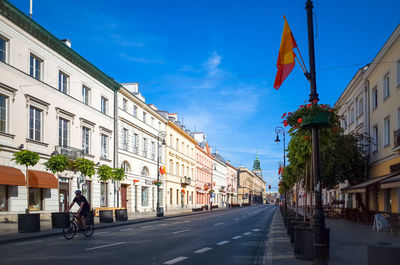 Empty road along built structures