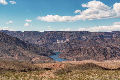 Scenic view of landscape and mountains against sky