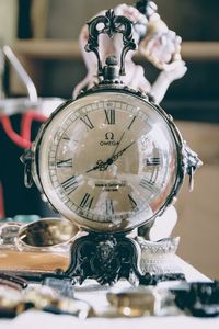 Close-up of clock on table