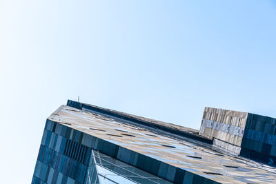 Low angle view of modern building against clear sky