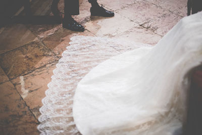 Low section of bare feet on floor