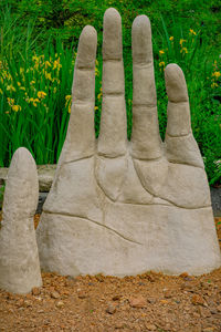 Statue against stone wall