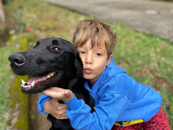 Portrait of child with dog