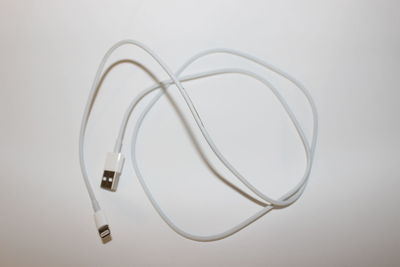 High angle view of eyeglasses on table against white background