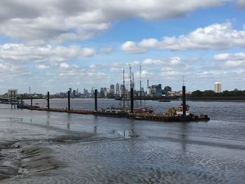 Sailboats in sea against sky