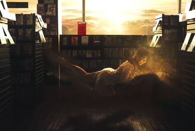 Full length of woman in bookstore