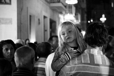 Portrait of friends standing in city