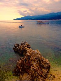 Scenic view of sea against cloudy sky