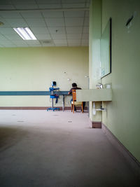 Hospital staff sitting on the chair waiting for the patients.