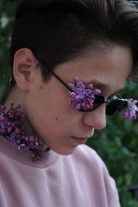 Portrait of guy who wears sunglasses with lilac 