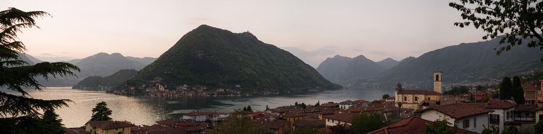 Panoramic view of sea and buildings against sky