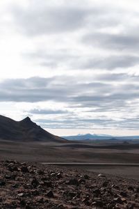 Scenic view of arid landscape against sky