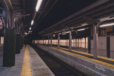 Train at railroad station at night