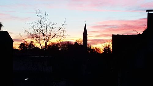 Silhouette of building at sunset