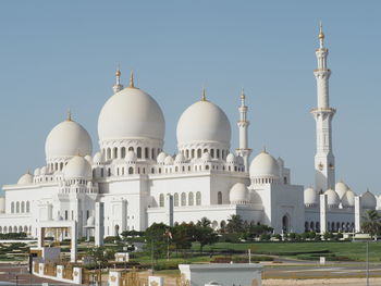 View of white mosque against clear sky