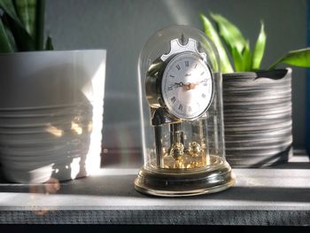 Close-up of clock on table