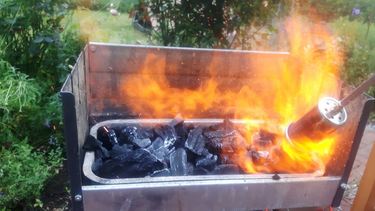 CLOSE-UP OF FIRE ON BARBECUE