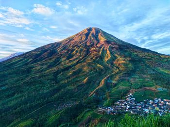 Scenic view of volcanic mountain against sky