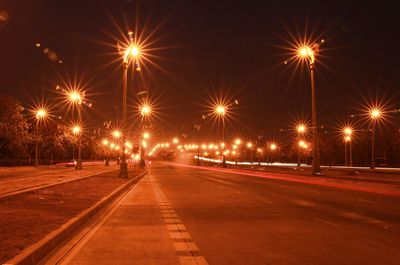 Illuminated light trails on road at night