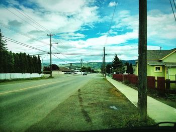 Road against cloudy sky