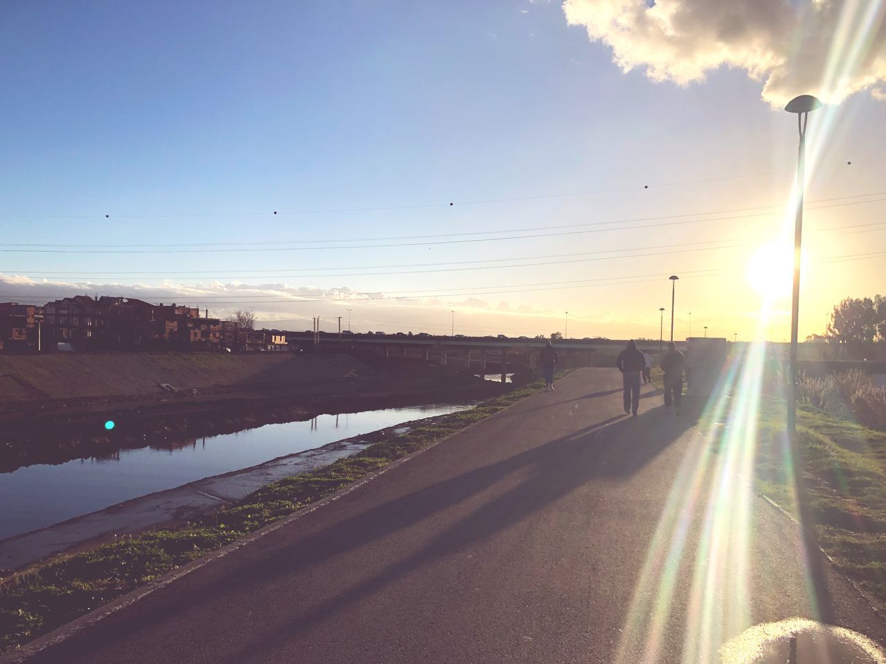 lens flare, sun, sunset, sunlight, sunbeam, sky, no people, road, water, motion, transportation, nature, outdoors, scenics, beauty in nature, day