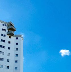 Low angle view of building against clear blue sky