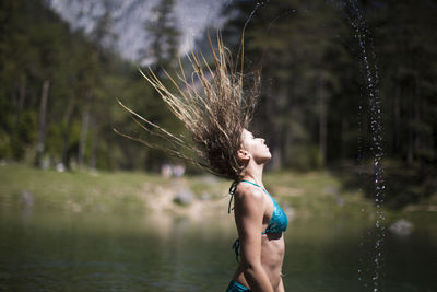 Woman standing in lake