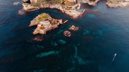 High angle view of rock formation in sea