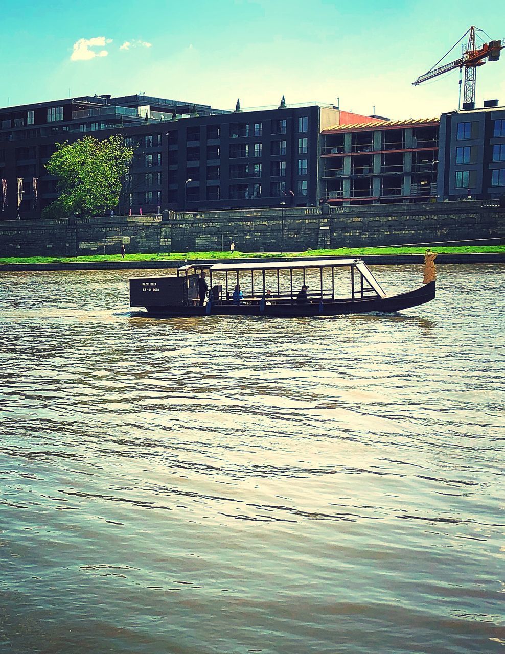 SCENIC VIEW OF RIVER AGAINST BUILDINGS