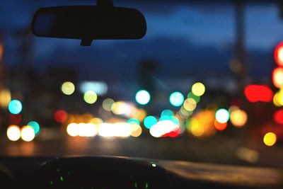 Lens flare on road seen through car windshield