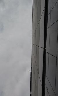 Low angle view of skyscraper against sky