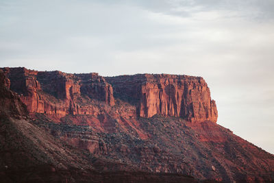 Red sandstone and vermillion cliffs at dusk near moab utah