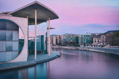 Marie-elisabeth-luders-haus by spree river against sky at twilight