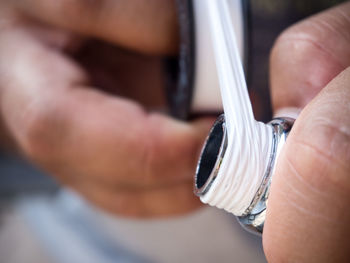 Close-up of man holding hands