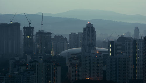 High angle view of buildings in city against sky