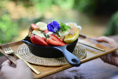 Close-up of fruits in plate on table