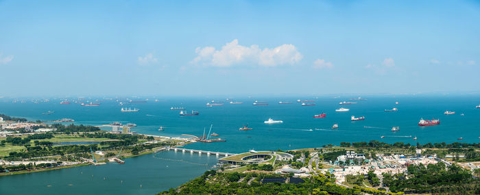 High angle view of sea by buildings against sky