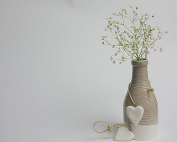 Close-up of white flower vase on table