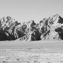 Scenic view of snowcapped mountains against clear sky