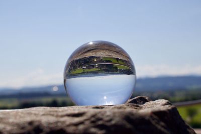 Close-up of crystal ball on glass