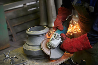 Midsection of man working in factory