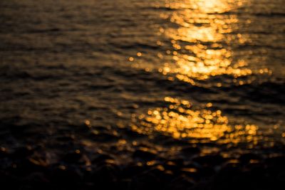 Reflection of clouds in water at sunset