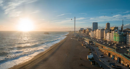 High angle view of beach against sky during sunset