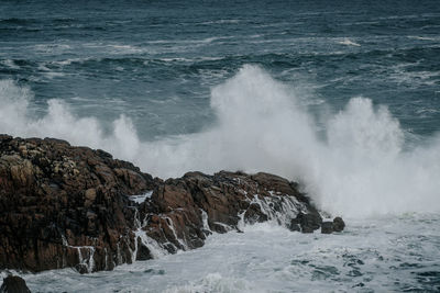View of waves splashing on rocks