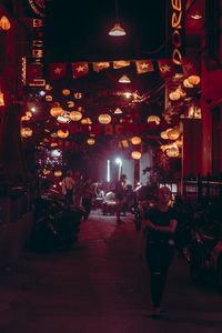 Group of people in illuminated building at night