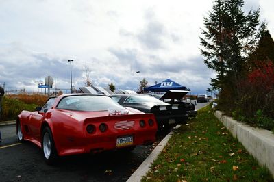 Cars on road against sky