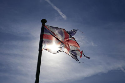 Low angle view of flag against sky