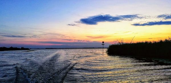 Scenic view of sea against sky during sunset