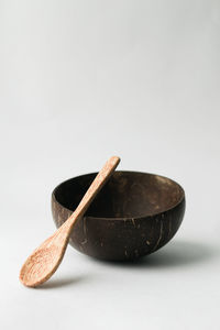 Close-up of eggs in bowl against white background