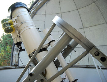 Low angle view of pipes against sky